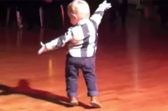 Baby hears favorite Elvis song at party and has the whole crowd cracking up at his moves